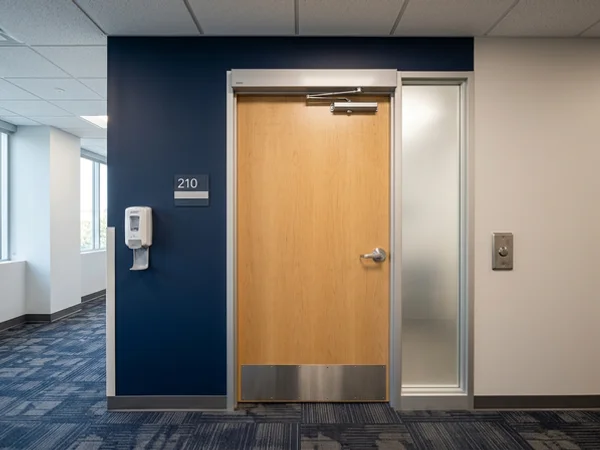 After: clinic door with low-energy operator and push plate