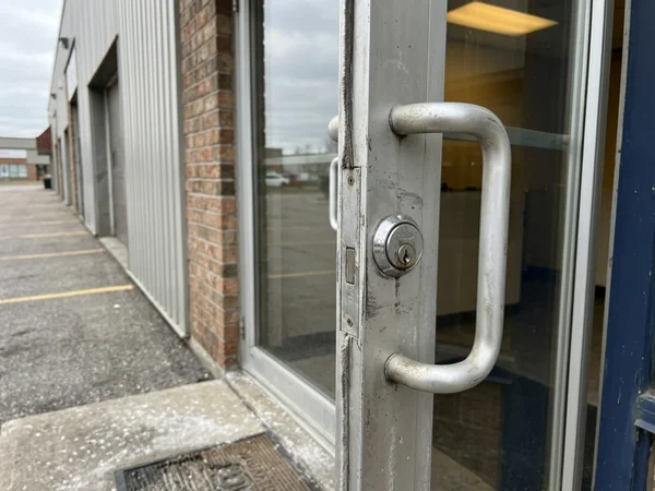 Before: keyed front entrance with worn lock in Newmarket